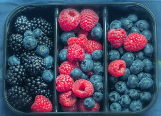Fresh assorted raspberries, blackberries and blueberries
