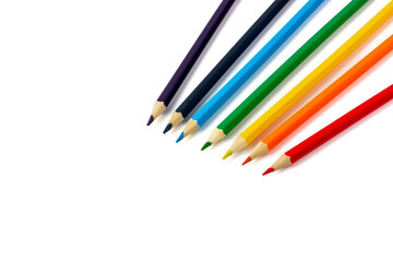 Colored pencils on a white background. Stationery. Children's pencils.