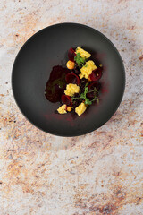 Haute cuisine, River Trout Fillets Pouched in the Wine, Under Beet root Sauce and caviar