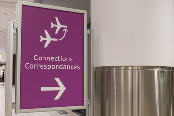 Connections sign on the floor of an international airport terminal.