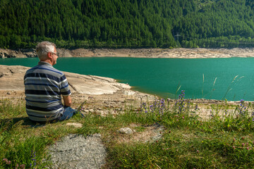 Man at Ceresole lake, Aosta valley