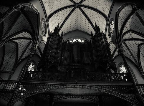 Organ in interior of Saint-Eugene-Sainte-Cecile neo-gothic church in Paris, France.  Black white historic photo.