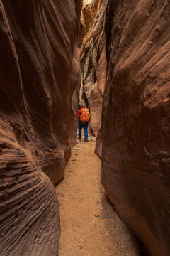 Traveler walking in dry canyon