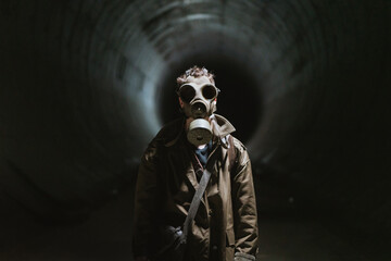 Anonymous man exploring underground tunnel
