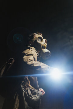 Anonymous man exploring underground tunnel