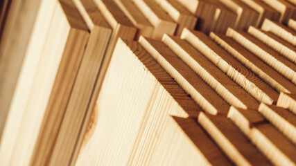 Stacked wooden carpentry boards from natural wood in a woodworking industry