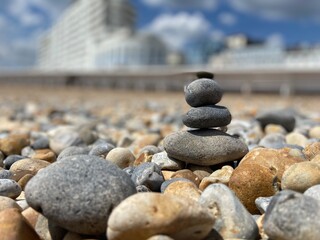 Stone balance rocks on pebble beach in St leonards on sea, Hastings, East Sussex UK