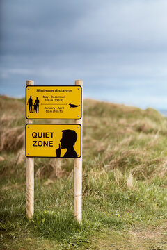 Warning yellow signboards on hilly terrain in Iceland
