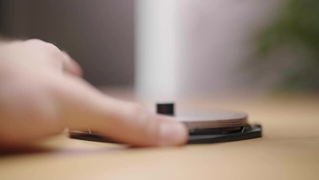 Opening a small cake of empty DVD or CD media packaging 4K