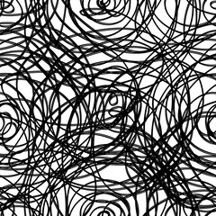Abstract hand drawn shapes doodle seamless pattern. Black freehand scribbles on white background. Abstract wallpaper design, textile print