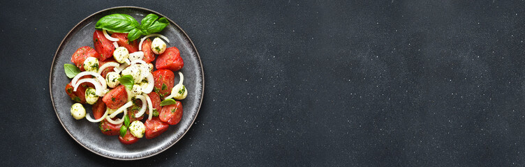 Mix salad with mozzarella, tomatoes and pesto sauce. Caprese appetizer with pesto...