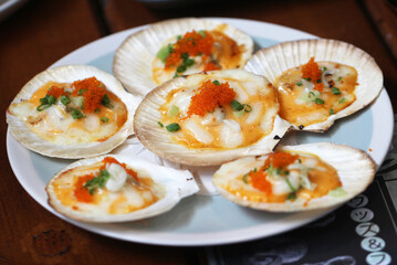 grilled scallops shell with butter,cheese, garlic  and eggs shrimp toping