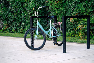 Fototapeta na wymiar Bike or bicycle parking. Locked Bike in empty parking lot