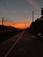 Fototapeta na wymiar railway station at sunset