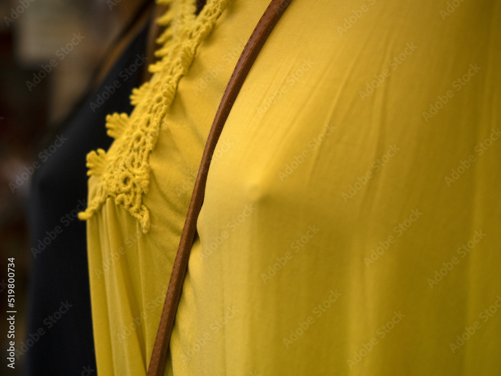 Wall mural yellow female dress detail at the market detail