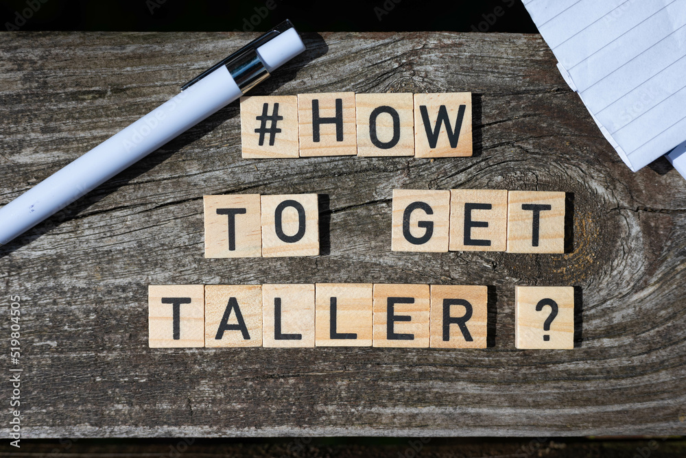 Fototapete how to get taller question letters on wooden blocks on a wooden table with pencil and paper at the s