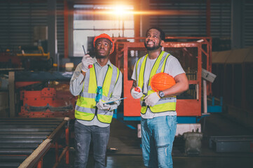 Teamwork African American black man are worker and working in metal heavy factory