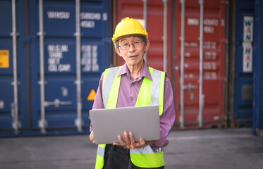 Asian man Senior Engineer worker shipment containers import export