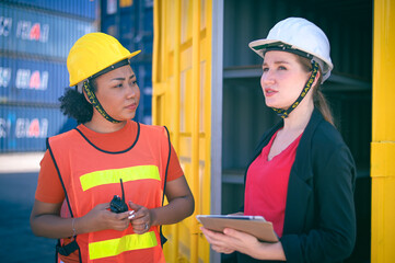 Team worker American women Work in an international shipping yard area Export and import delivery service with containers