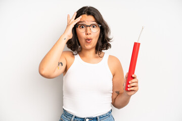 hispanic pretty girl looking happy, astonished and surprised. dynamite concept