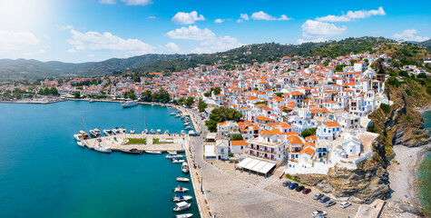Panoramic view of the beautiful town of Skopelos island with white houses and red roofs, Sporades,...
