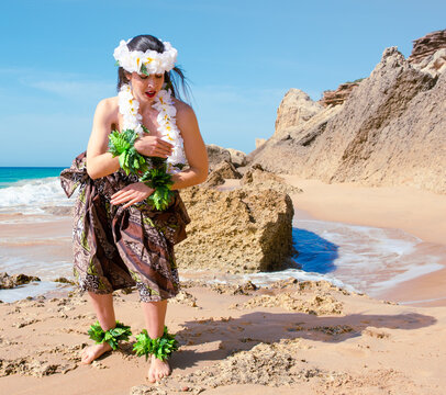 Hula dancer performing hawaii dance. Girl dancing wearing tahiti summer clothes. Miss queen flower crown