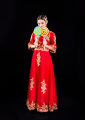 A woman in a red Traditional Chinese wedding dress