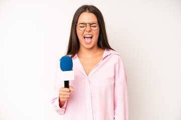 hispanic pretty woma laughing out loud at some hilarious joke. journalist with a microphone
