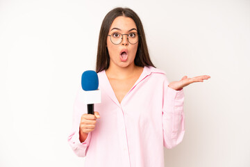 hispanic pretty woma feeling stressed, anxious or scared, with hands on head. journalist with a...