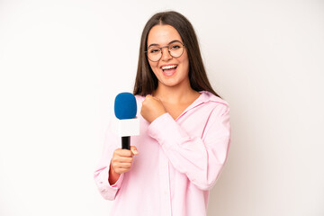 hispanic pretty woma feeling happy and astonished at something unbelievable. journalist with a...