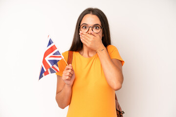 hispanic pretty woma feeling confused and puzzled, showing you are insane. england flag concept