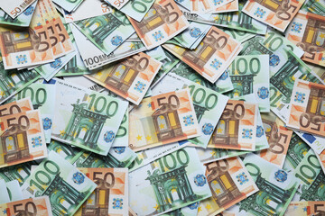 Different Euro banknotes as background, top view. Money exchange