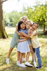 Fototapeta premium Group of asian and caucasian kids having fun in the park