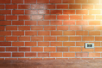 Fototapeta na wymiar Red brick wall decorate in the room and morning sun light shining.