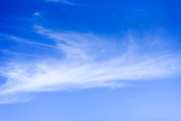 Summer blue sky with white clouds. Blue background with place for text.