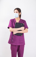 A female nurse in a purple uniform