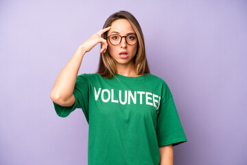 pretty caucasian woman looking surprised, realizing a new thought, idea or concept. volunteer...