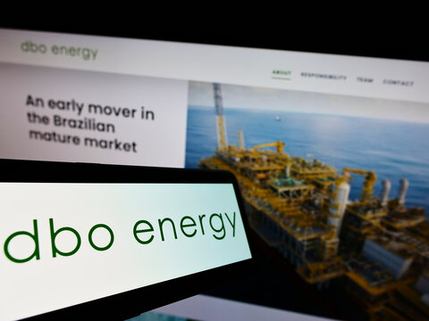 Stuttgart, Germany - 01-08-2022: Mobile phone with logo of Brazilian oil and gas company DBO Energy SA on screen in front of business website. Focus on center of phone display.