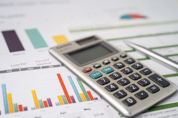 Calculator on chart and graph spreadsheet paper. Finance development, Banking Account, Statistics, Investment Analytic research data economy, Stock exchange trading, Business company concept.