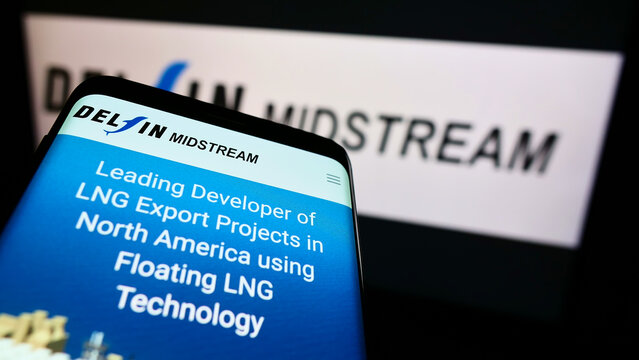 Stuttgart, Germany - 01-08-2022: Mobile phone with website of US LNG energy company Delfin Midstream LLC on screen in front of business logo. Focus on top-left of phone display.