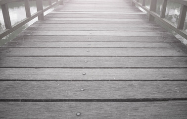 Fototapeta premium The old wooden bridge is empty with no traffic.