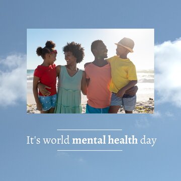 Digital image of happy african american parents and kids at beach, world mental health day text