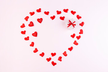 Big heart of small hearts with mock-up on a pink background. Concept of holidays and Valentines Day.