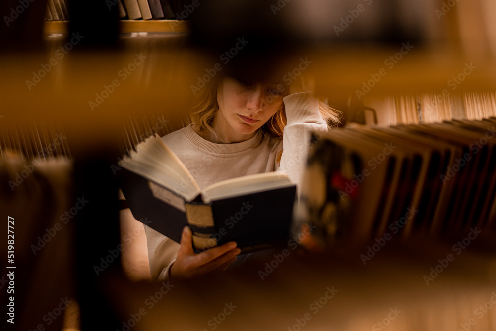 Poster Girl reading in library