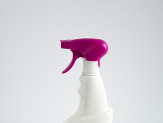 White blank plastic spray detergent bottle with a violet sprayer isolated on white background....