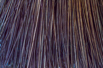 Straw texture. Several threads in vertical and glossy lines.