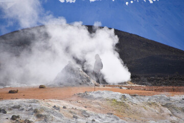 Smoke from a fumarole enveloping a tourist