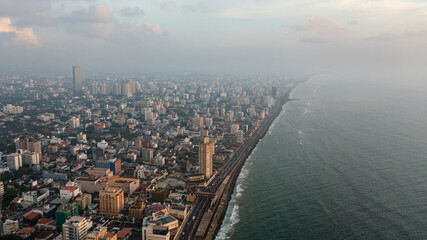 Colombo city with buildings and streets at sunset. Sri Lanka.