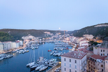 Fototapeta na wymiar boats in the harbor, marina Bonifacio in background, port of Bonifacio, Corsica, France