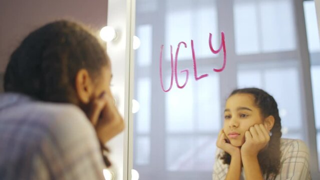 Teenage girl having appearance insecurities, victim of bullying, peer pressure